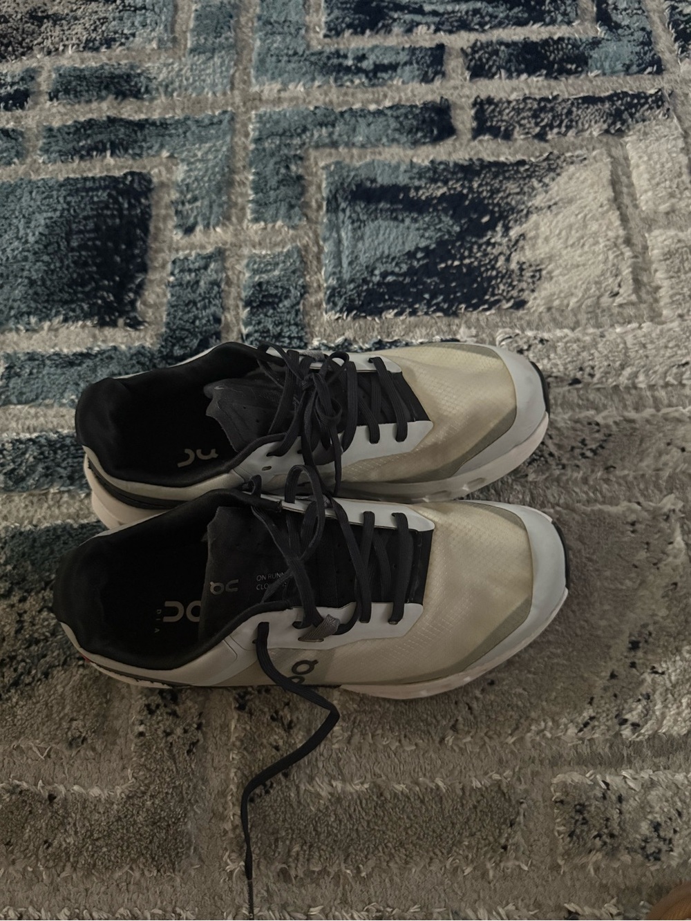 On Running White and Black Performance Running Shoes